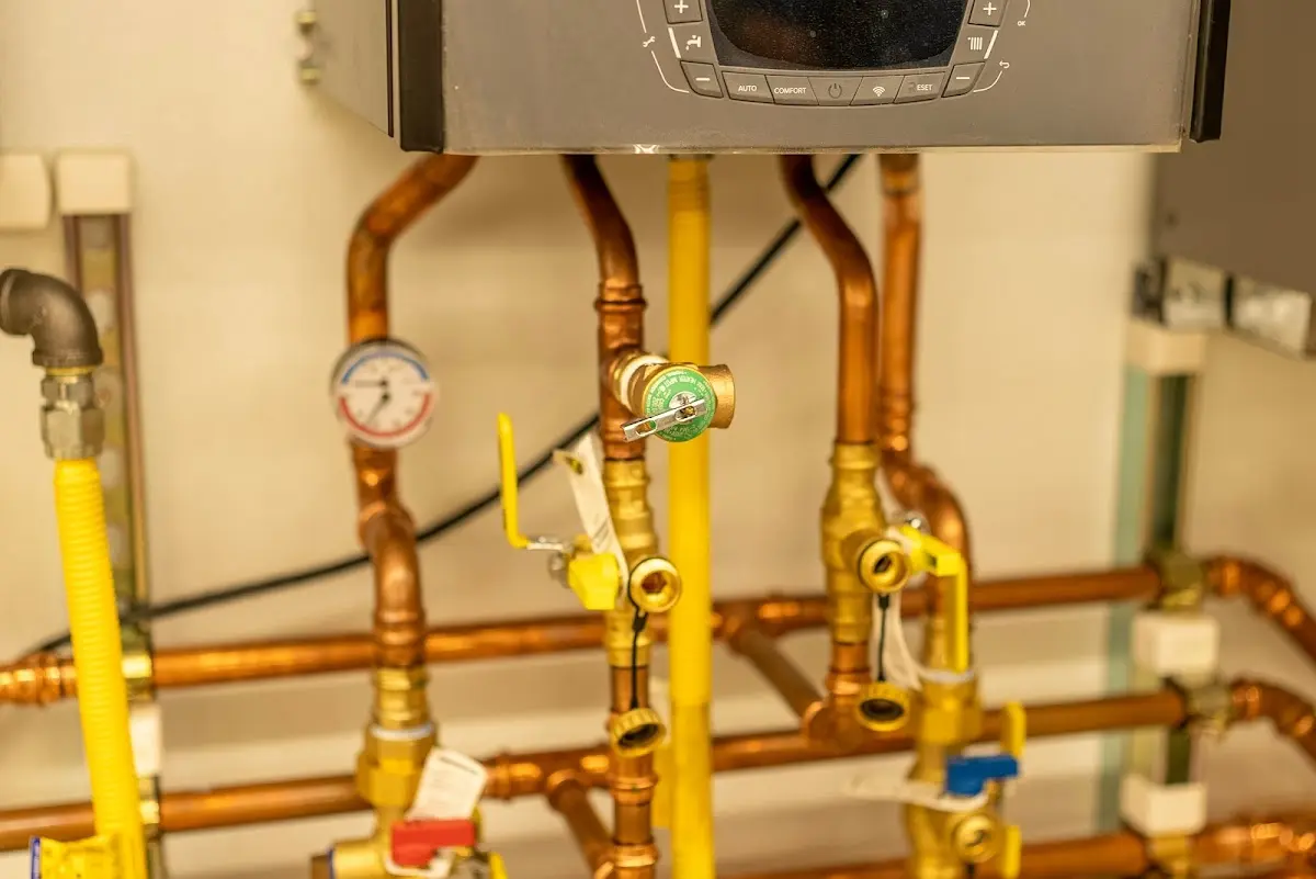 Licensed technician providing Water Heater Installation for a homeowner in Marquette